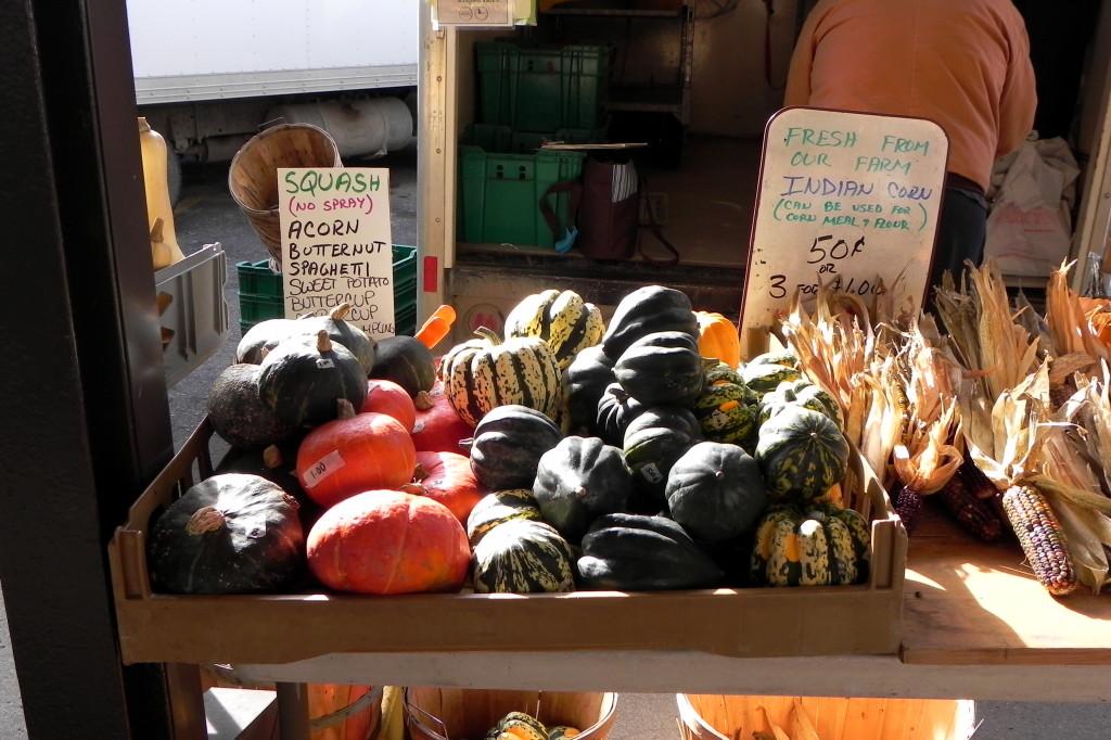 Acorn squash, a popular fall vegetable, displayed at the J and T Todosciuk Farms stall at the Ann Arbor Farmers Market.