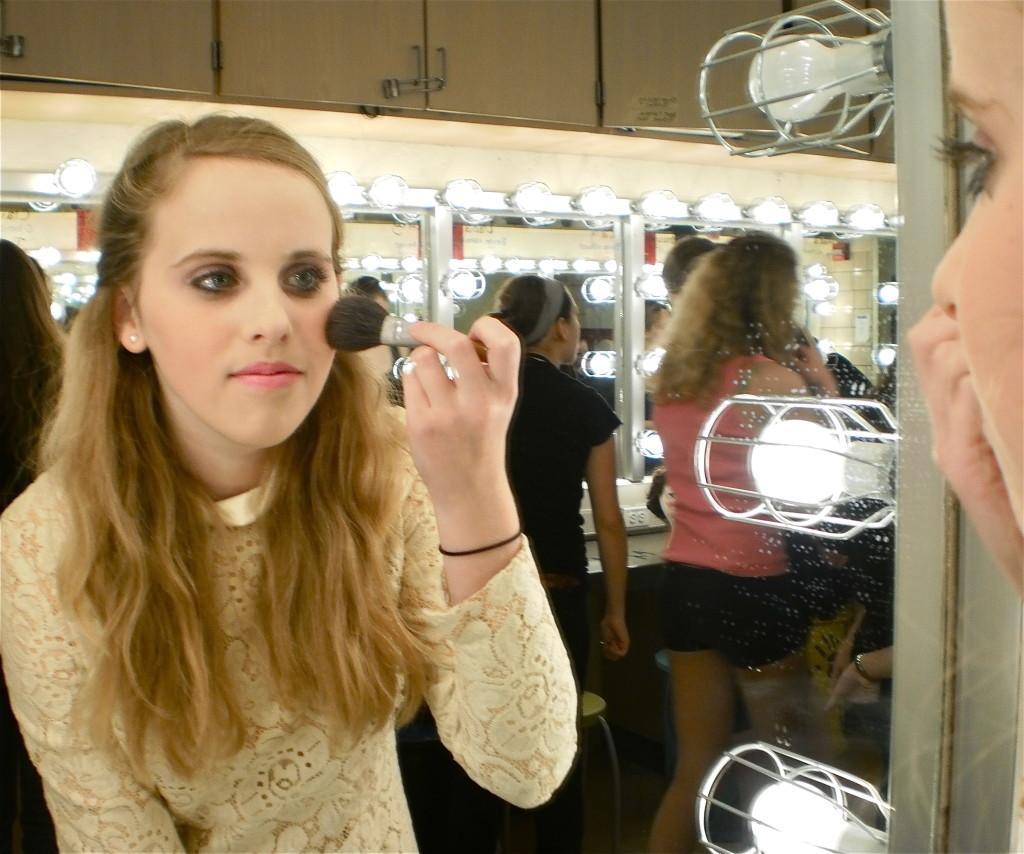 Abby Lauer, a CHS freshman, gets ready backstage for Pioneer Theater Guilds Hairspray.