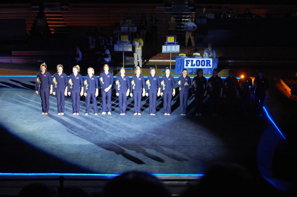 The+U+of+M+gymnastics+team+lined+up+at+the+beginning+of+the+meet+to+sing+the+star-spangled+banner