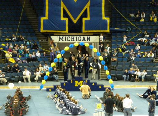 Kylee Botterman (center) and Jordan Sexton (right) accept their awards for uneven bars. 