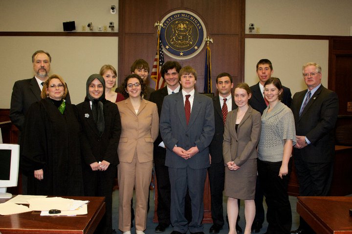 2010 Mock Trial team posses for a picture after defeating Kalamzoo in the state finals.