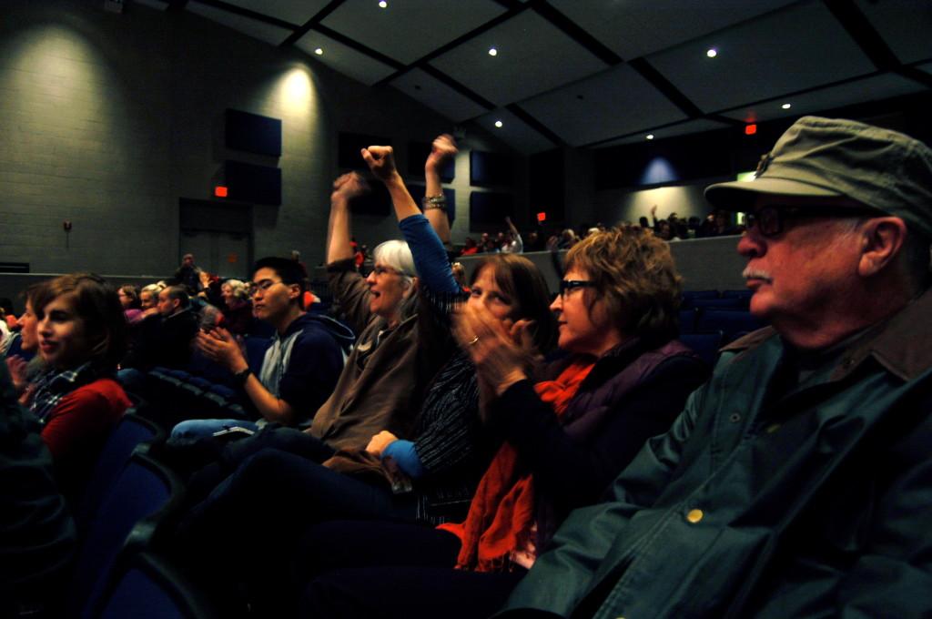 Community High teachers cheer while listening to the speakers at the rally. There nine speakers in all.