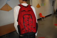 A CHS student carries his backpack to class
