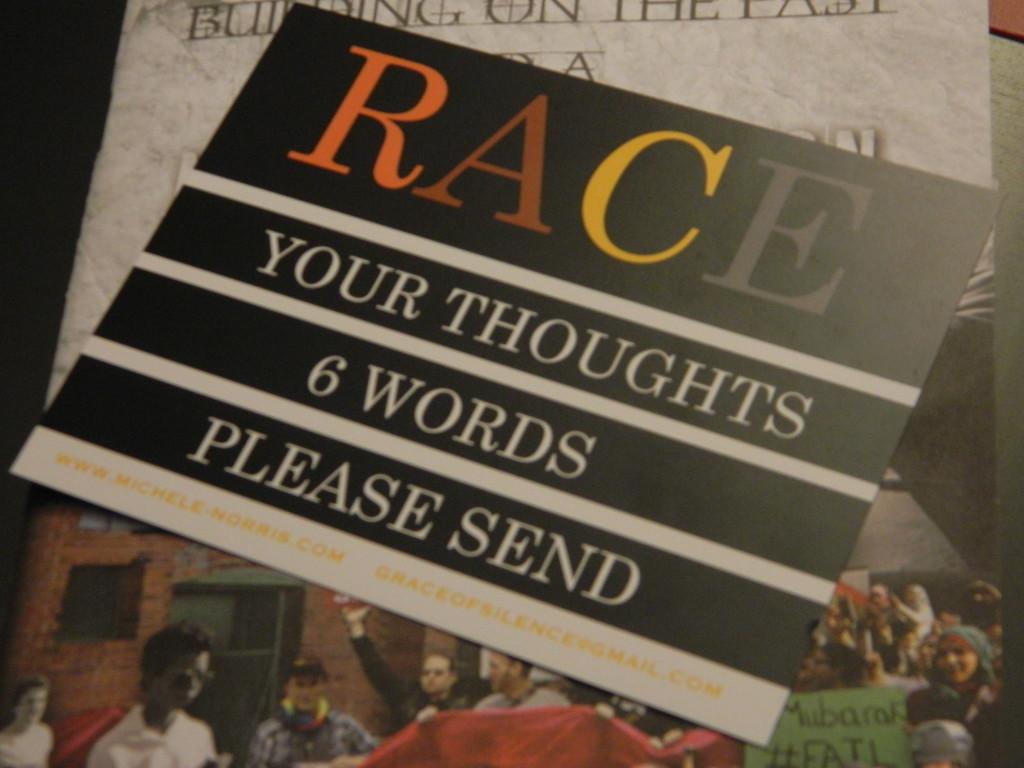 A+race+card+from+Norriss+project+on+the+back+of+which+people+are+encouraged+to+write+six+words+phrases+or+thoughts.