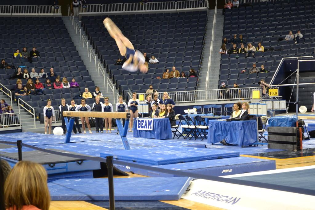 Katie Zurales performs her dismount on balance beam. 