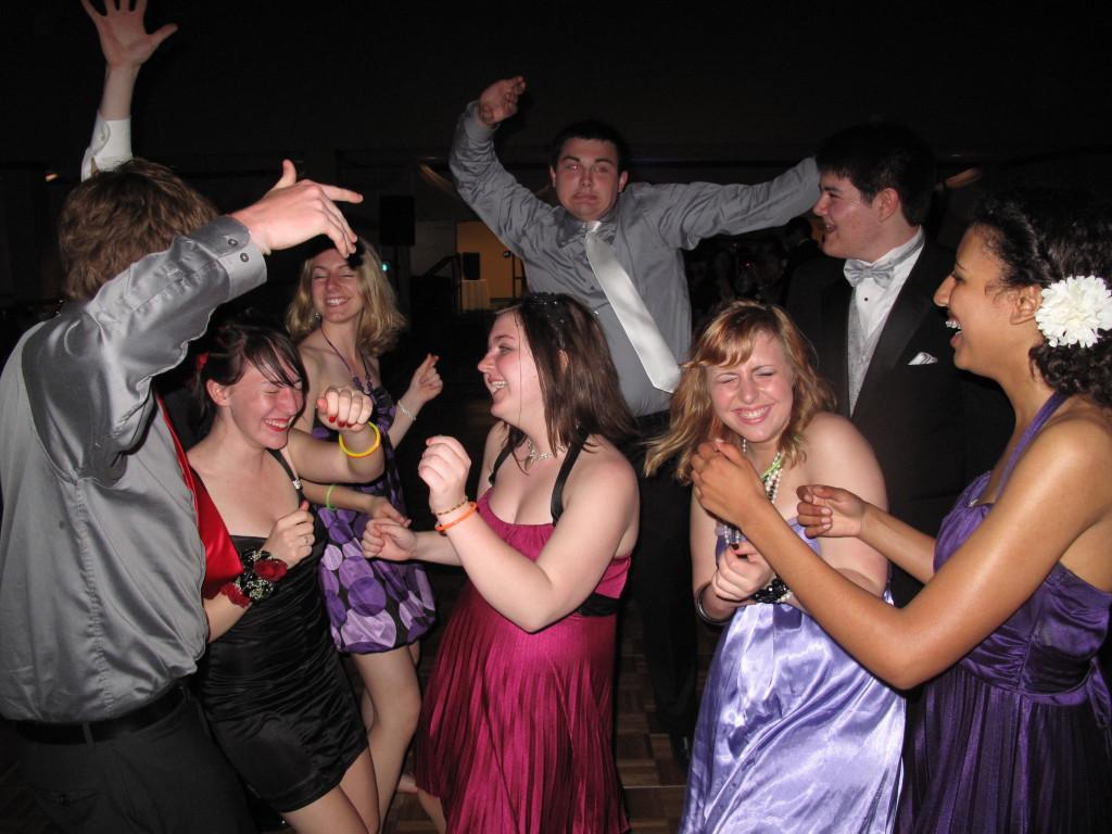 A group of friends dance at the 2011 prom.