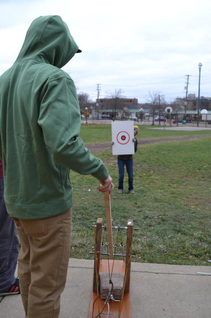 Courtney attempts to administer the accuracy test on a launcher from block four