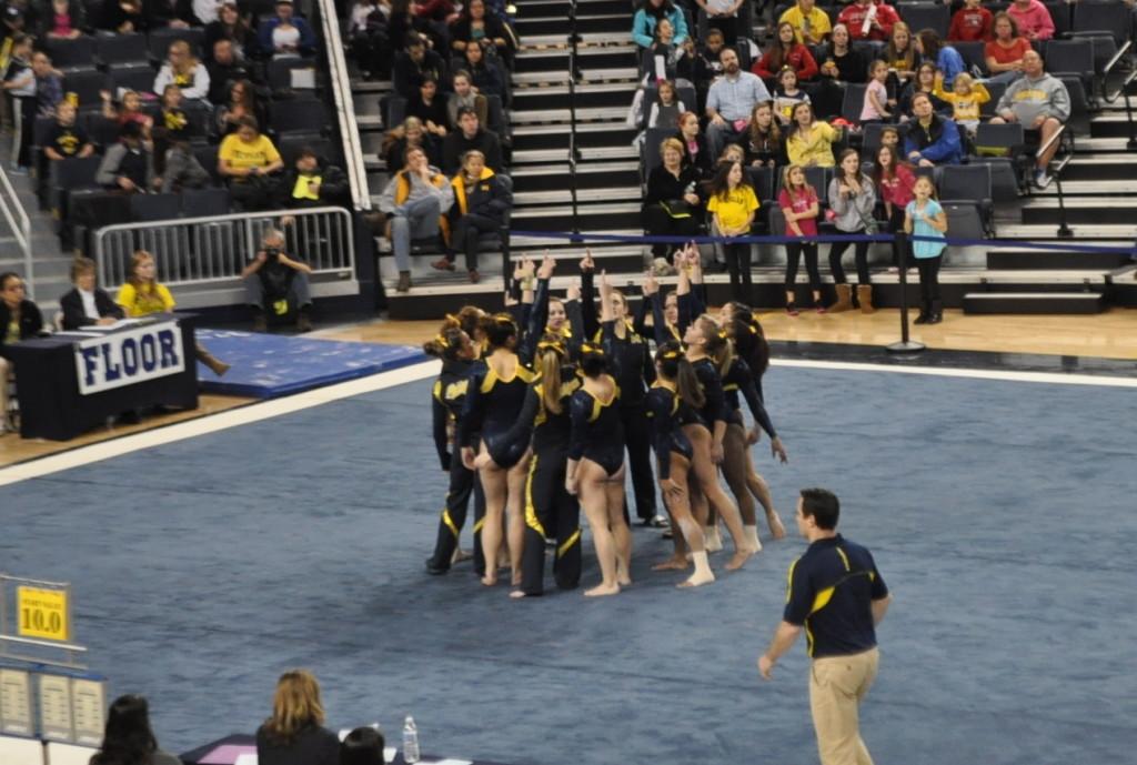 The team prepares for floor, the last rotation of the competition.