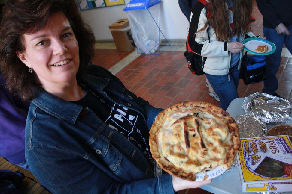 Diane Grant appreciates the artistry of a pie before it is demolished.