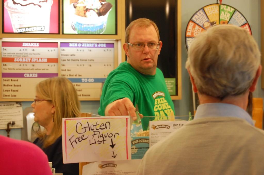 Matt Arthur, the owner of the Ann Arbor Ben and Jerrys, grabs a cone for a customer.