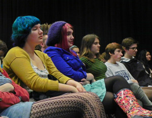 CHS poets listen to other writers and wait for their turn to read onstage