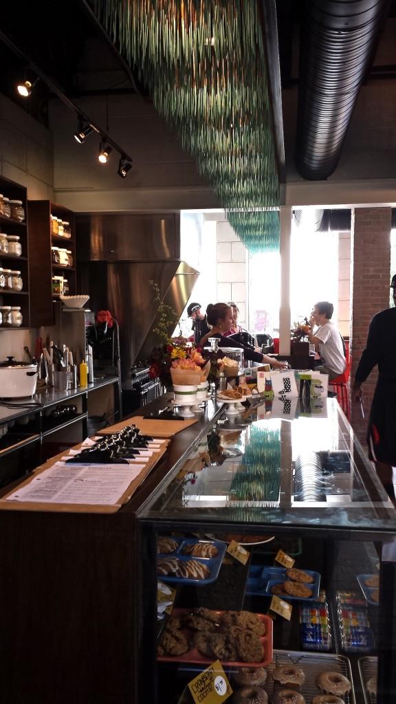 The handmade soffits hang over the front counter and wrap around the restaurant.