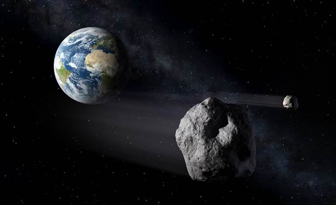 An artists rendition of an asteroid passing earth.