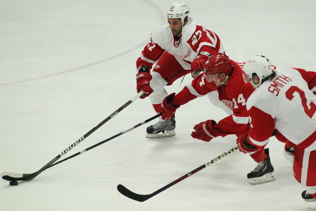 Gustav Nyquist works his way past Kyle Quincey and Brendan Smith