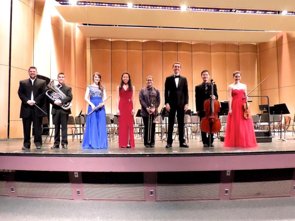 (from left to right) Orchestra director Mr. Glawe, Elliot Polot, Anna Latterner, Sarah Xie, Halley Bass, Sam Kidd, Jin Nakamura, and Emma Sandberg 