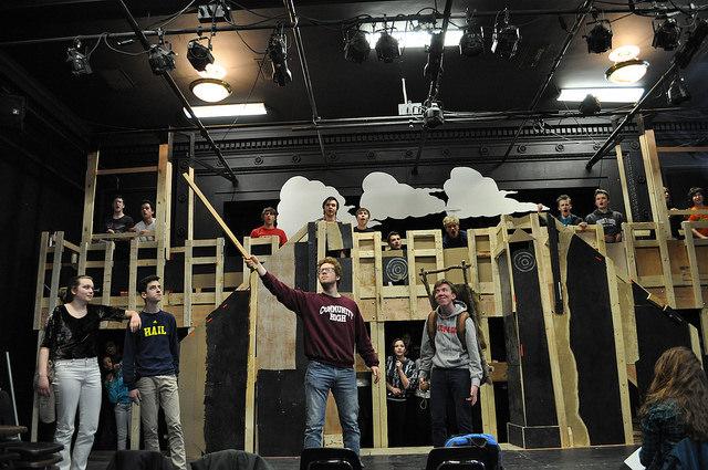 Rehearsal a week before opening night. Oren Levin (center left) portrays King Arthur holding Excalibur. Milo Tucker-Meyer (center right) portrays Patsy, servant/steed of King Arthur. Sophia Werthmann (far left) and Isaac Scobey-Thal (second from the left) portray Dennis widowed mother and Dennis Galahad respectively.