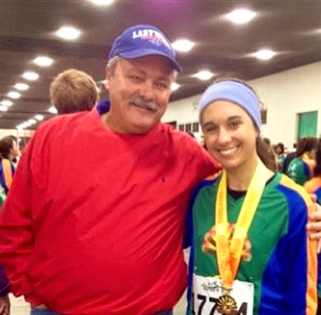 Carlee Faber and her dad, Pat Faber, at a cross country race before Carlee left home to attend Central Michigan University. 