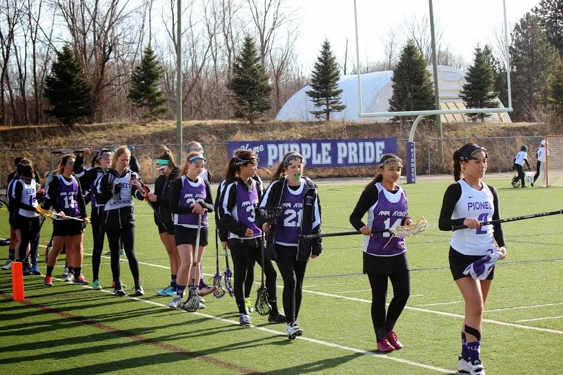 The Pioneer Womens Lacrosse team lining up for a stick check before their game against Skyline. 