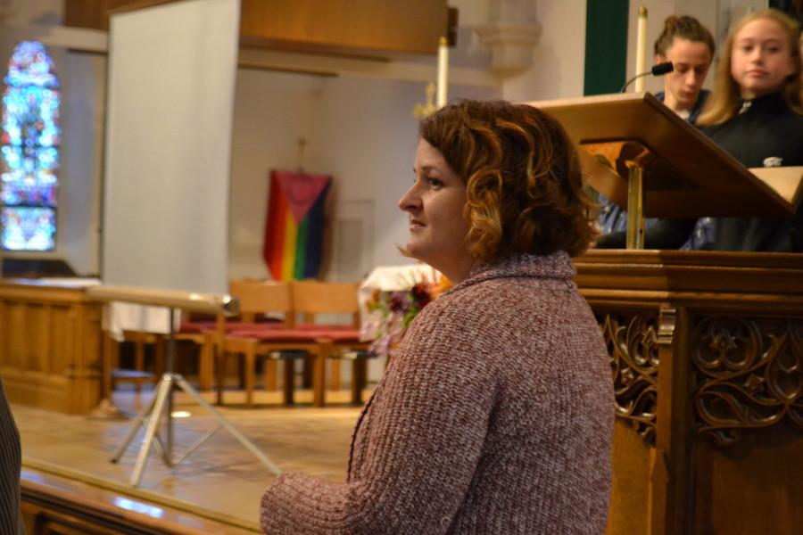 Mary Schlitt looks on at the crowd of Community students in St. Andrews church on Tuesday.