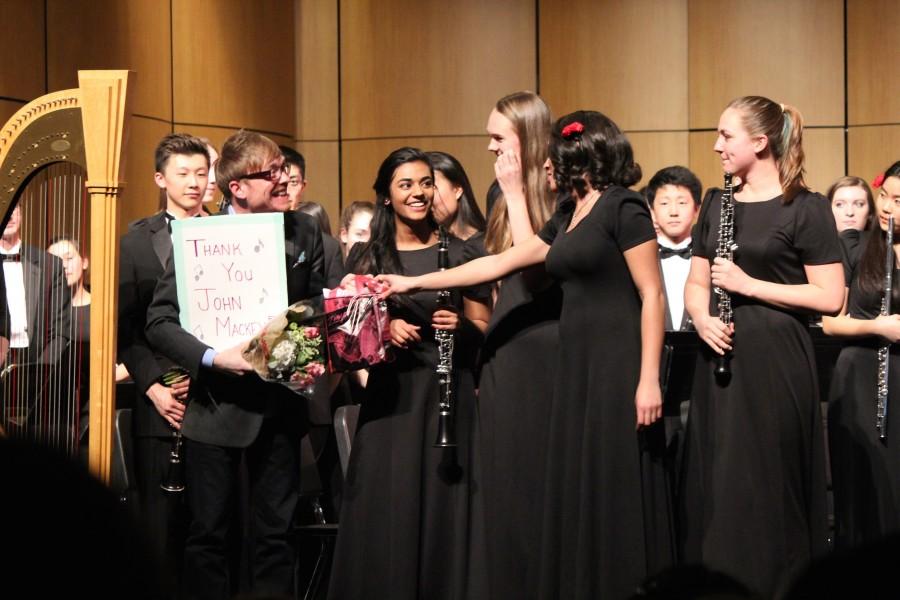 The Ann Arbor Pioneer Band awards a card signed by all the members to John Mackey. 