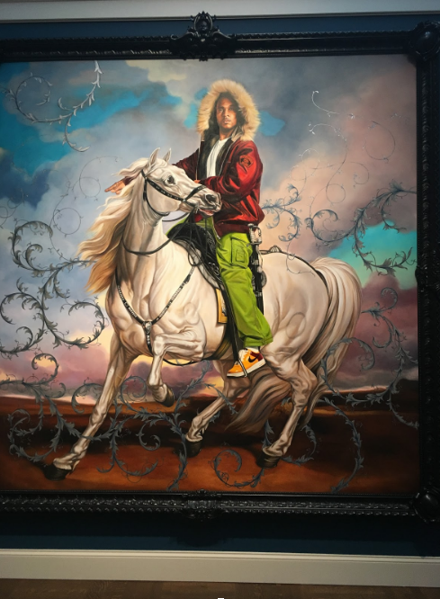 Painting by Kehinde Wiley, African American male sitting on a horse to with Air force 1s with a sword on his hip to impersonate Napoleon.