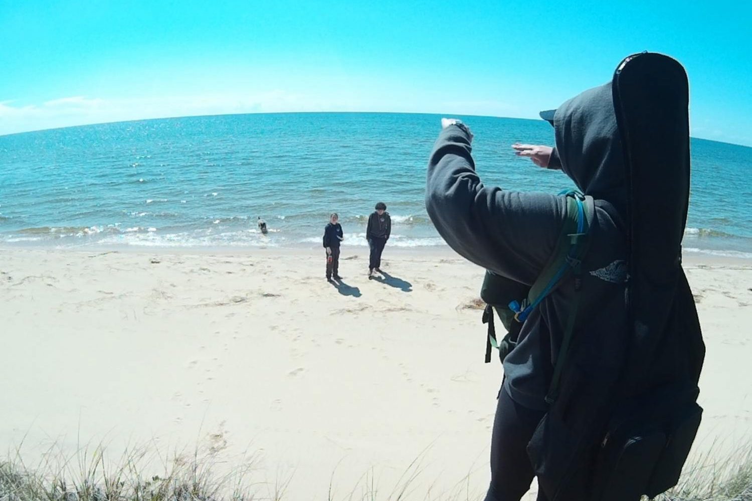 Naomi Cutler, counselor at Camp Lookout, stands on the Lake Michigan beach after having spent a day in the woods doing an activity known as “Listening Point.” During Listening Point, campers spread out in the forest, spending hours alone in nature. Some, like Cutler, brought instruments such as guitars and ukuleles. Others could be found reading, writing in notebooks, or simply laying amongst the leaves and looking up at the trees above. No matter what activities they chose to do, all the Listening Point participants were spending the day taking in the natural world—without cellphones.