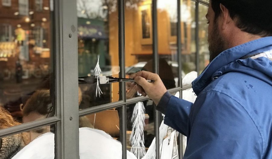 The Novemberistas have been painting the Kerrytown windows for over 35 years. This is Naroozs fourth year painting the Kerrytown windows. 