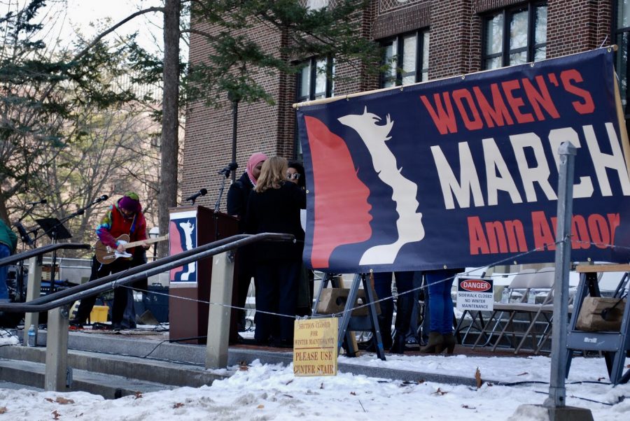 The stage at the Ann Arbor 2018 Womens March.  The march marked the anniversary of the original Womens March, which was held across the nation to protest Donald Trumps presidency and to push for equality. These pictures show people, signs, and moments from the rally.