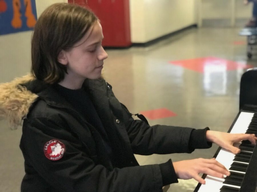 Durr sits at the piano on the third floor of Community High School, performing for students that walk by. 
 One of Durrs current goals is to play Rachmaninov’s second piano concerto with a full orchestra.