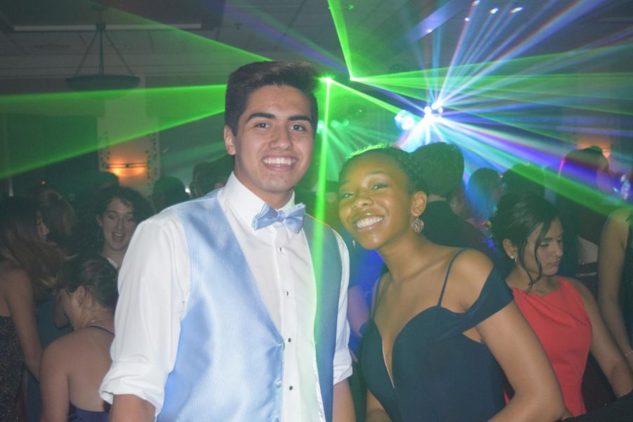 Jorge DiGiovanni and Chloe Allen step off the dancefloor to smile for a picture.