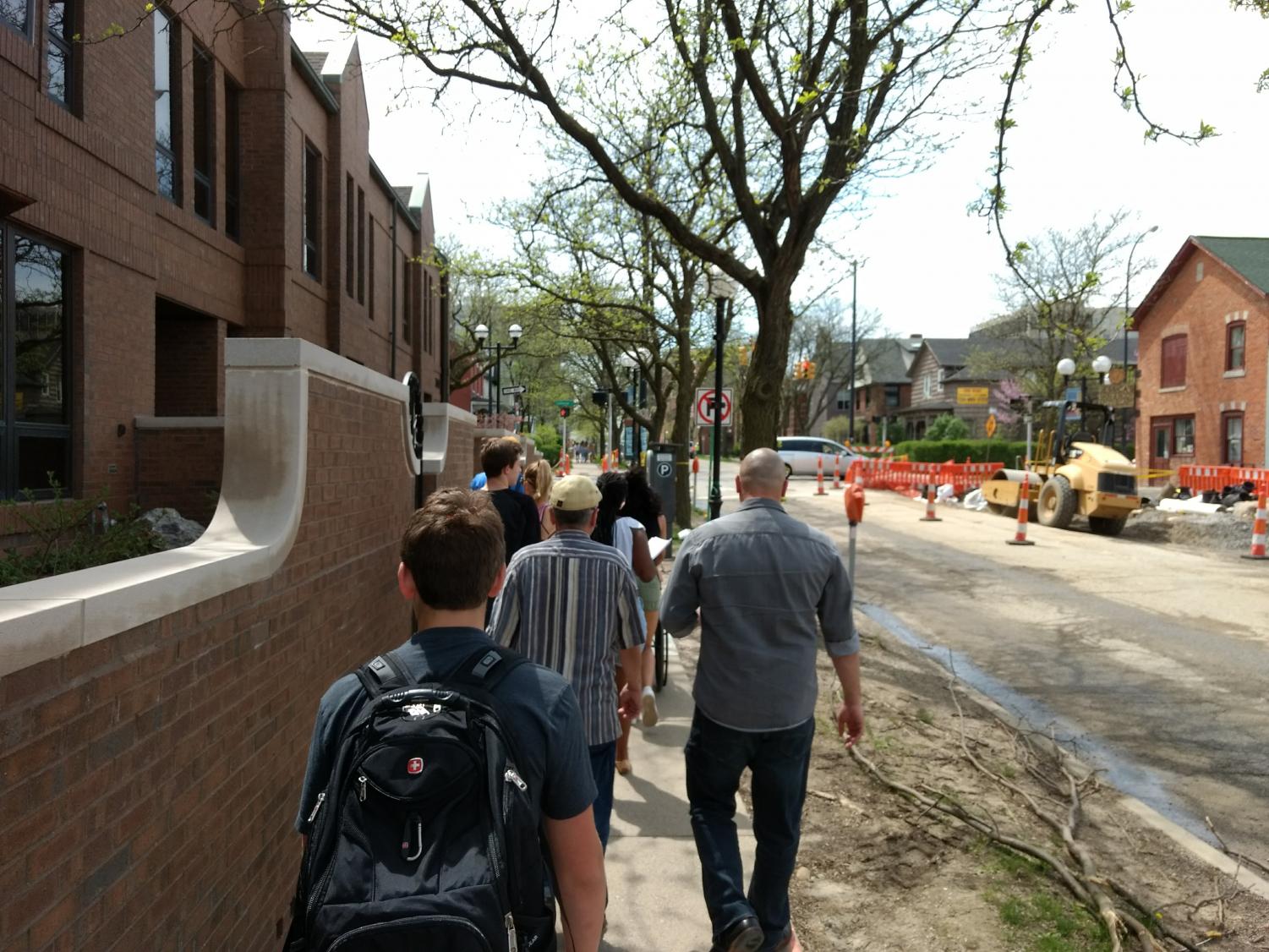 Jess Letaw, an architect for Ann Arbor, talks about the history of the courthouses in Ann Arbor. As the students were furiously scribbling down notes, Letaw smiled as she noted that the students weren't just blowing off the tour.