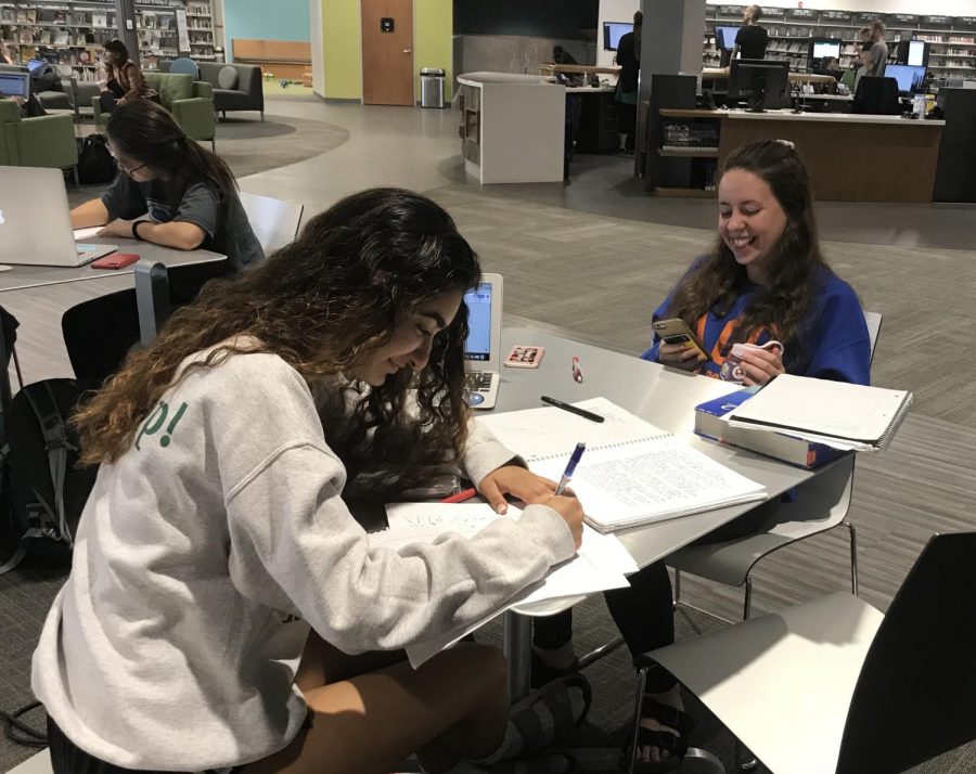 Kheterpal and Axinn sit at their table studying math for an upcoming final.