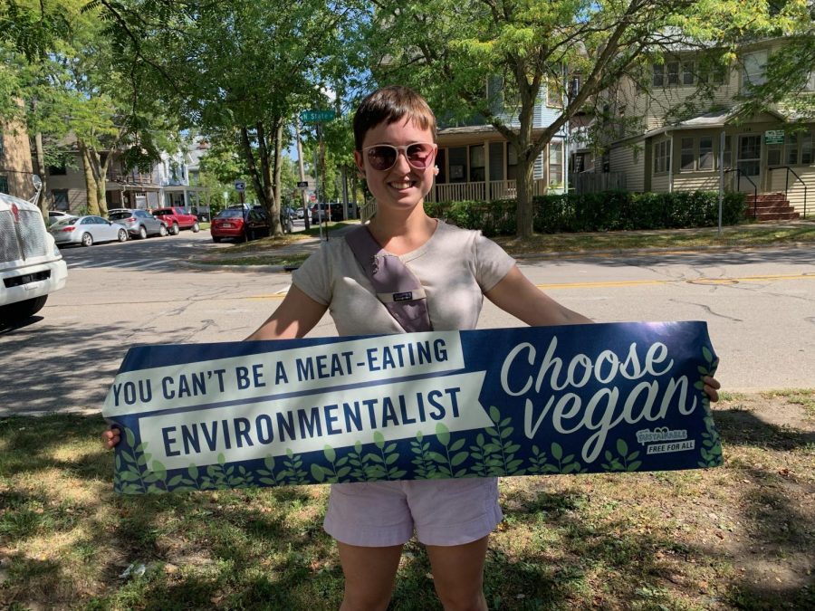 Jacqueline Webster proudly holds up the sign she brought to the Climate Strike.