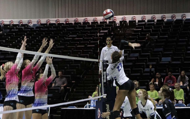 Harper Murray spikes the ball, gaining a point for the Skyline Eagles.