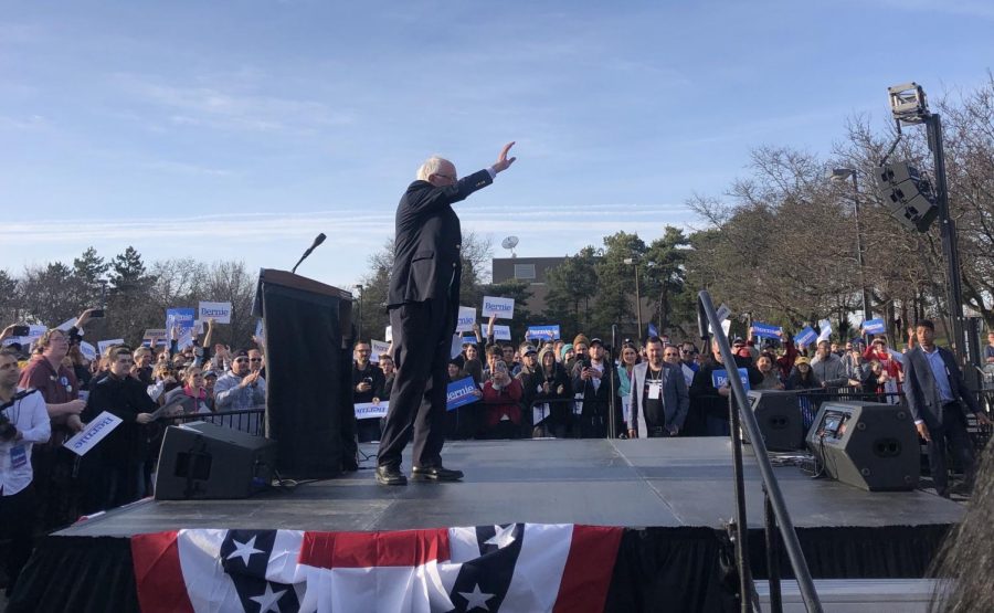 Sen. Bernie Sanders waves to his supporters at a rally in Warren, Michigan.