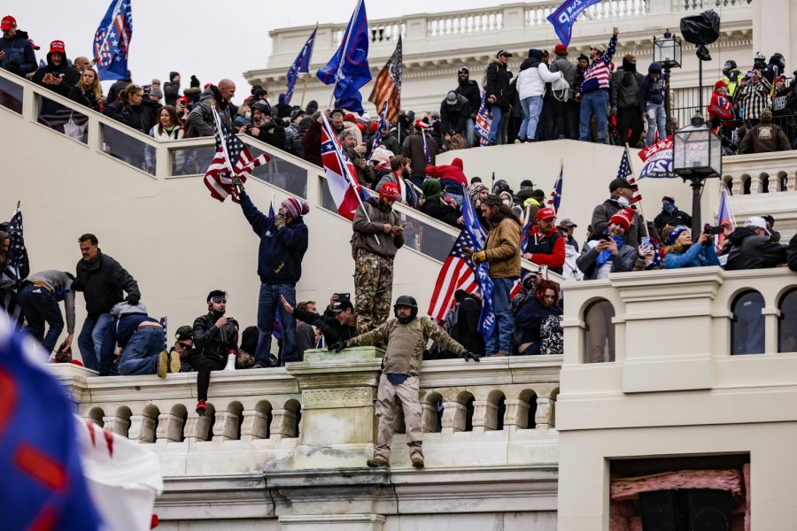 Pro-Trump+supporters+storm+the+U.S.+Capitol+following+a+rally+with+President+Donald+Trump+on+Wednesday%2C+Jan.+6%2C+2021.+%28Samuel+Corum%2FGetty+Images%2FTNS%29