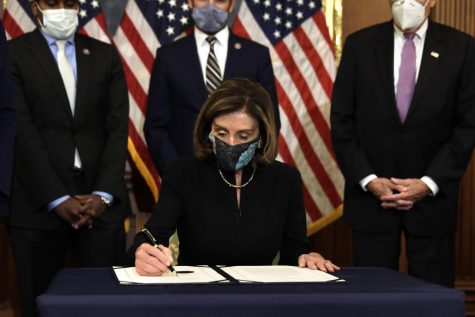 Speaker of the House Nancy Pelosi, D- Calif., signs the article of impeachment against President Donald Trump during an engrossment ceremony on Capitol Hill in Washington, D.C., on Wednesday, Jan. 13, 2021. (Yuri Gripas/Abaca Press/TNS)