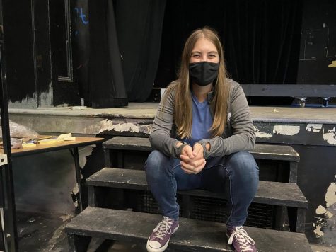 Sarah Hechler sits on the steps of the stage in Craft Theater. As the new tech director of CET, she has spent a lot of time in Communitys black box theater.