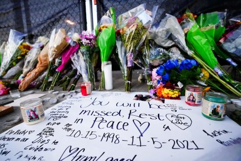 Candles, flowers and letters are placed at a memorial outside of the canceled Astroworld festival at NRG Park on Nov. 7, 2021, in Houston