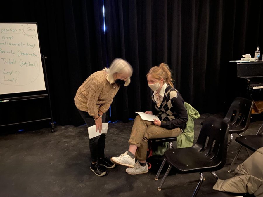 Ellen+Stone+and+Gillian+Perry+converse+during+the+intermission+of+Poetry+Clubs+All+Hallows+Eve+reading.+Perry+recited+a+poem+during+the+reading%2C+and+Stone+is+the+advisor+of+the+club.