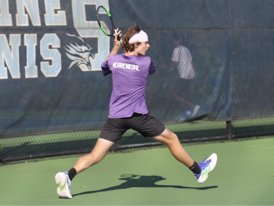Isaac Herrenkohl lunges for a slice backhand during Pioneer’s rival match against Sky- line. Herrenkohl had high hopes for the season as the state tournament nears. “We know we are a capable team with the talent to [win
a state champion- ship],” Herrenkohl said.