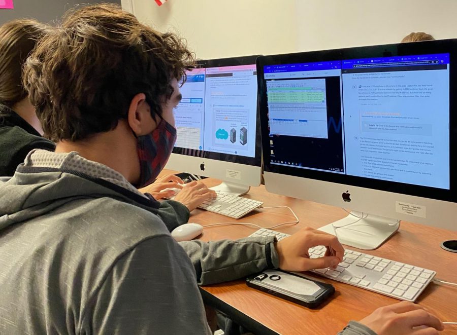 Cybersecurity student Oliver Hiltz-Perron captures packets of data from a virtual machine.