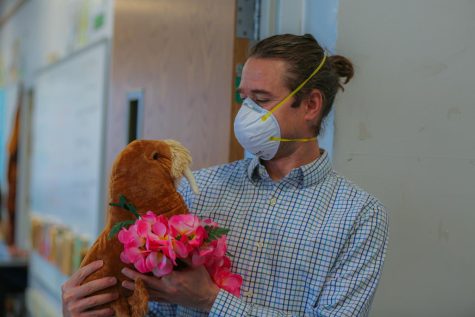 Matt Johnson stands outside Room 306 holding his stuffed walrus, a present from a student. Johnson has always felt at home at CHS. “It was always a place I had circled, and one that turned out to be right,“ Johnson said