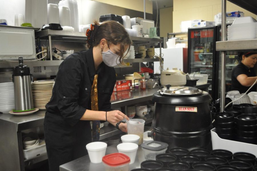 Leah White prepares a miso soup at Miki’s Japanese Restaurant to open. White enjoys talking to customers. “Even if you’re not making a major connection with someone, you can still meet new people and find out things about them,” White said.