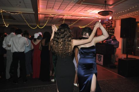 Students Scarlett London and Lila Ryan dance at prom. 