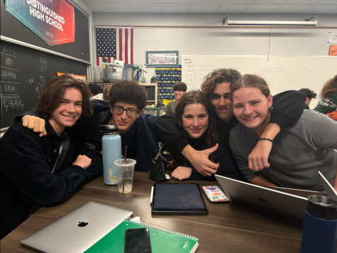Seniors Tommy Simon, Karim Mohamed, Zoe Simmons, Matthew Castilho and James Azim sit in their FOS 4 Physics class on Thursday, Oct. 20. Because of the half-day schedule, classes were only 30 minutes long.