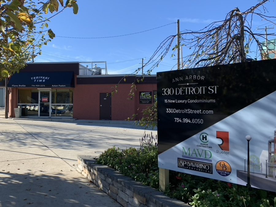 An advertisement for Detroit St. Condos stands against the now-empty Teriyaki Time storefront.