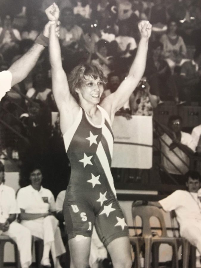 Tricia Saunders raises her arms in victory. Throughout her competition days, Saunders amassed four FILA Wrestling World Championships gold medals “When I see people who maybe did get a boost from Title IX and are going off and doing great things, like I was able to do, it makes me really happy,” Saunders said.