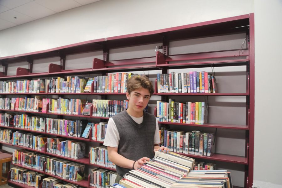 Ronan Laporte in the CHS library. Being a self-described “contrarian,” however, Laporte decided to read “The Communist Manifesto” as a way to explore the nuance of different governmental systems. “I want to grow up and do everything in my power to make it so that life for people who arent as privileged as me is dignified and valuable,” Laporte said.