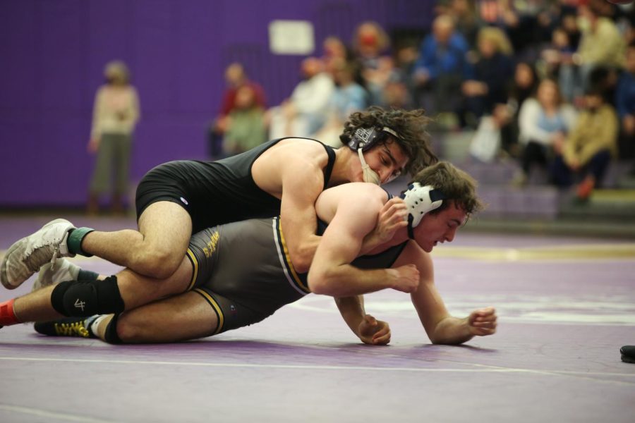 Pioneer's Raffi Avedissian wrestles an opponent from Saline during Pioneer's senior night. Avedissian is back wrestling for the Pioneers for his senior season after wrestling on a joint Pioneer-Skyline team last year due to lack of coaching and participation.
“I feel like as a senior, it’s good to have [Pioneer Wrestling] back for my final year,” Avedissian said. “I also feel like there is a bit of a pressure to set a standard for our program. We only have four or five seniors [on the team] this year, most of the kids are underclassmen, but I think the future is looking bright for Pioneer wrestling.”